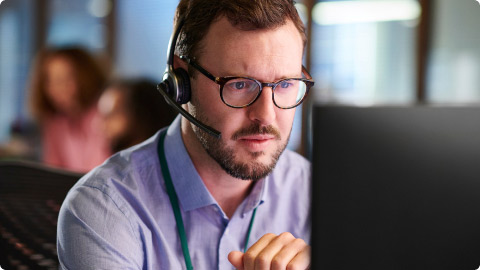 man working at computer on desk