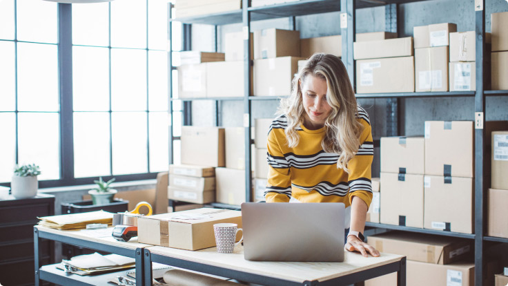 woman working at computer on desk